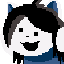 Portrait of a white–furred, black–haired, blue–sweater wearing dog creature with a happy expression and perky ears.