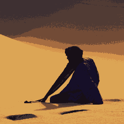 A man in the nighttime desert wearing blue robes and a turban sitting in front of three potholes in the orange sand.